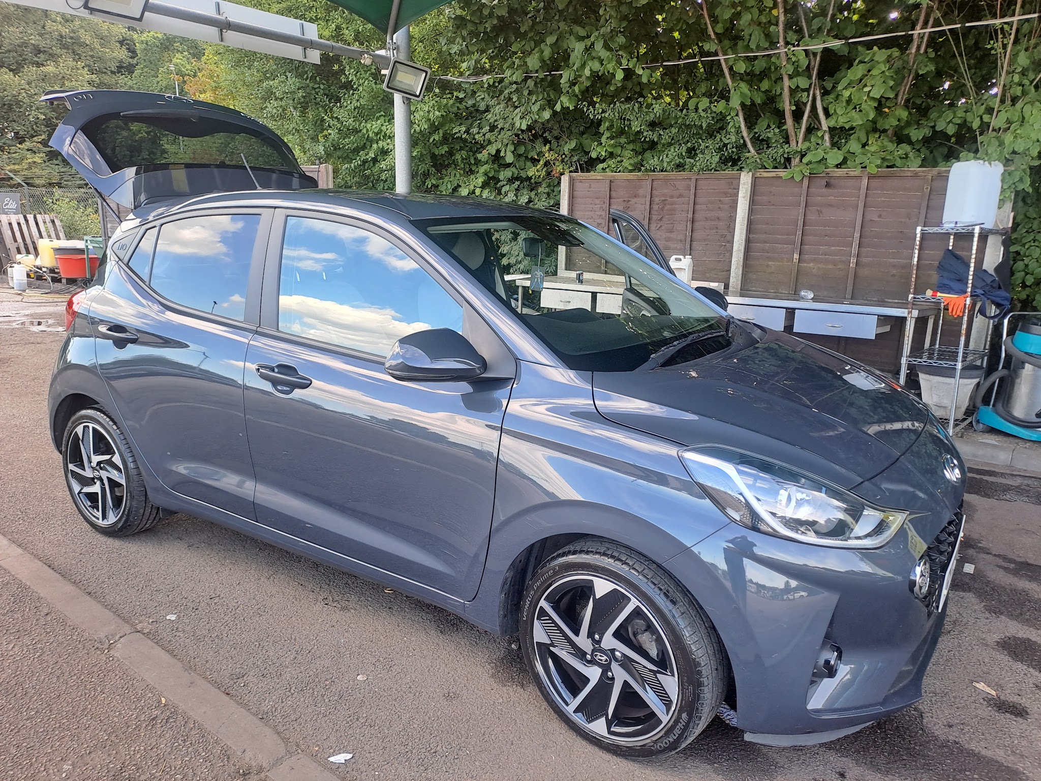 A freshly hand washed grey Hyundai i10 outside Elite Valeting